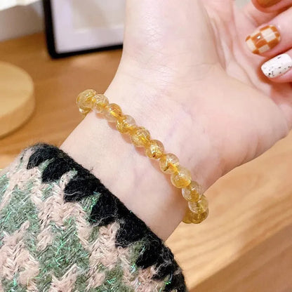 Gold rutilated quartz sunstone bracelet with round diamond shape and adjustable 20-24cm sizing