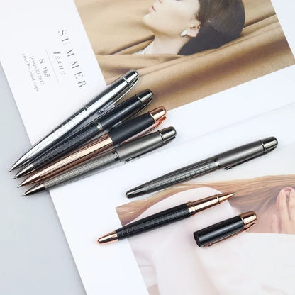 Gun grey metal rollerball pen with a metal barrel on a flat surface.