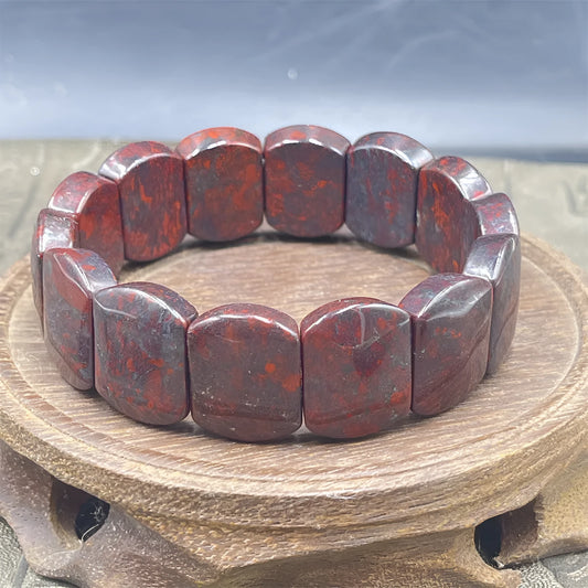 Bloodstone meteorite bracelet in quartz rock jade with traditional pendant options on wrist
