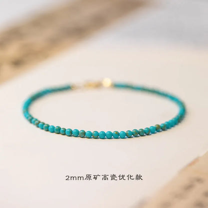 Close-up of a women's 2mm raw ore turquoise bracelet with geometric beads, showing its Chinese style and adjustable extension chain.