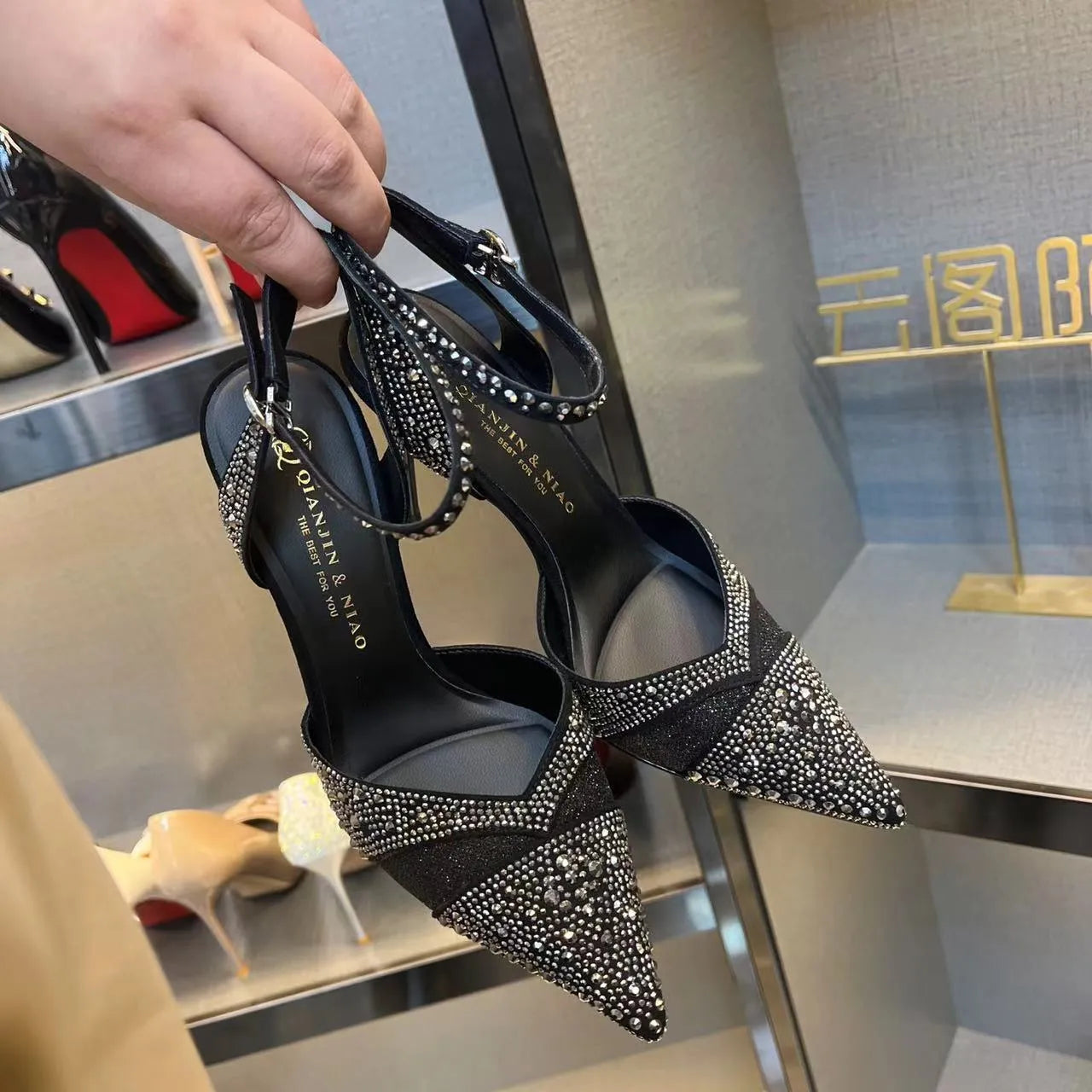 Women's hollow high heels with red sole, stiletto heel, and pointed toe in silver or black colours