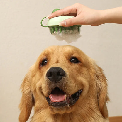 Handheld silicone pet hair remover and massage brush in blue, for use on dogs and cats during bathing.