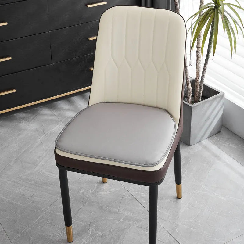 Leather horseshoe-shaped seat cushion in beige colour on a chair, showing non-slip base and 2.5cm thickness.