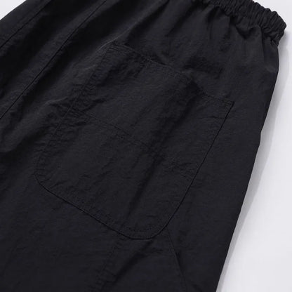 Black tooling paratrooper pants with elastic waist drawstring closure and baggy three-dimensional cutting
