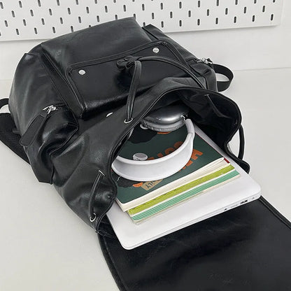 Large capacity PU travel backpack in black or brown with waterproof function and curved shoulder strap