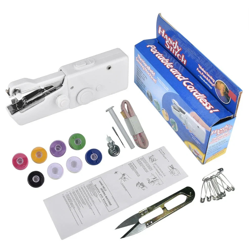 Black handheld electric sewing machine with ruler, scissors, and thread coils on white background