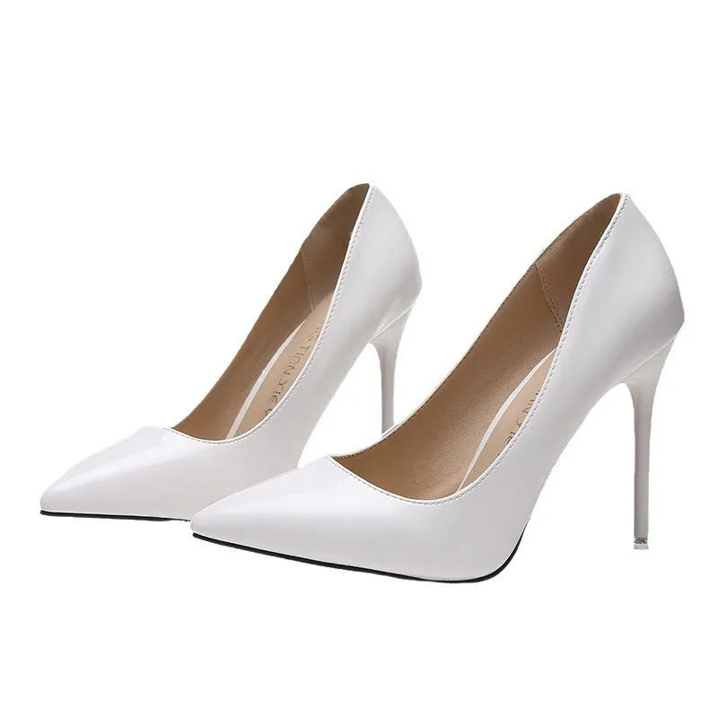 Women's pointed toe stiletto high heel pump in apricot colour with buckle detail.