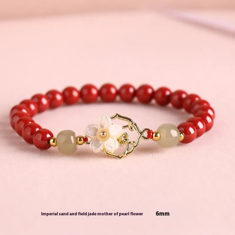 Handcrafted Hetian Jade New Chinese style bracelet in cinnabar with white butterfly, lotus and bells of Ireland motifs