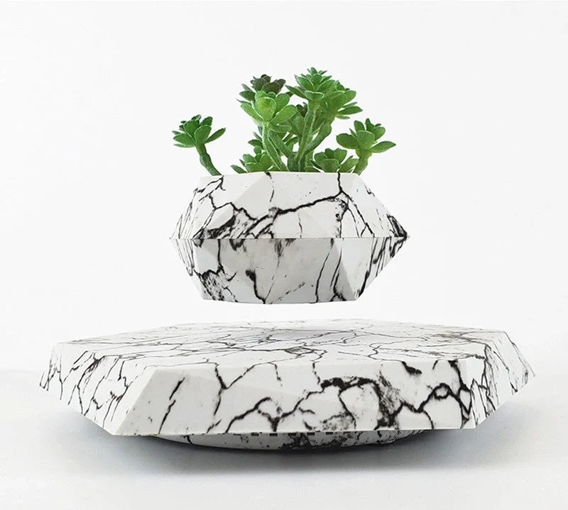Levitating Plant Pot with marble design floating in air