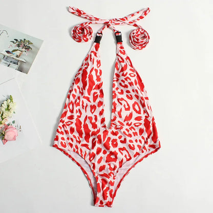 Backless leopard print one-piece swimsuit for women with a front buckle and bandage style design.