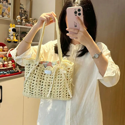 Handmade woven wool bag with floral pattern, approximately 0.5m tall