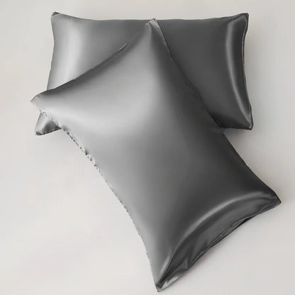 Silk-effect satin envelope pillowcase in navy blue showing envelope closure and smooth fabric texture