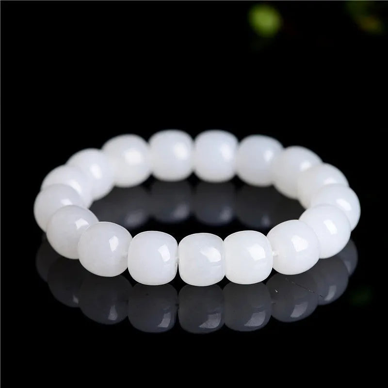 White jade barrel beads bracelet on wrist, showing Hetian jade stones in casual unisex design