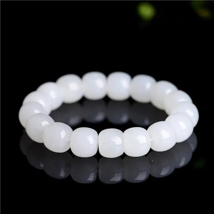 White jade barrel beads bracelet on wrist, showing Hetian jade stones in casual unisex design