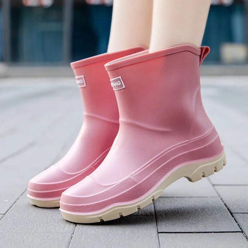 Women's low-cut white waterproof plastic shoes with a non-slip rubber sole on a plain background.