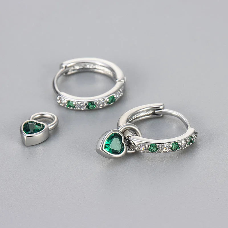 Fashion zircon earrings with 10mm heart-shaped drops in gold and white gold settings, showing diamond-treated stones