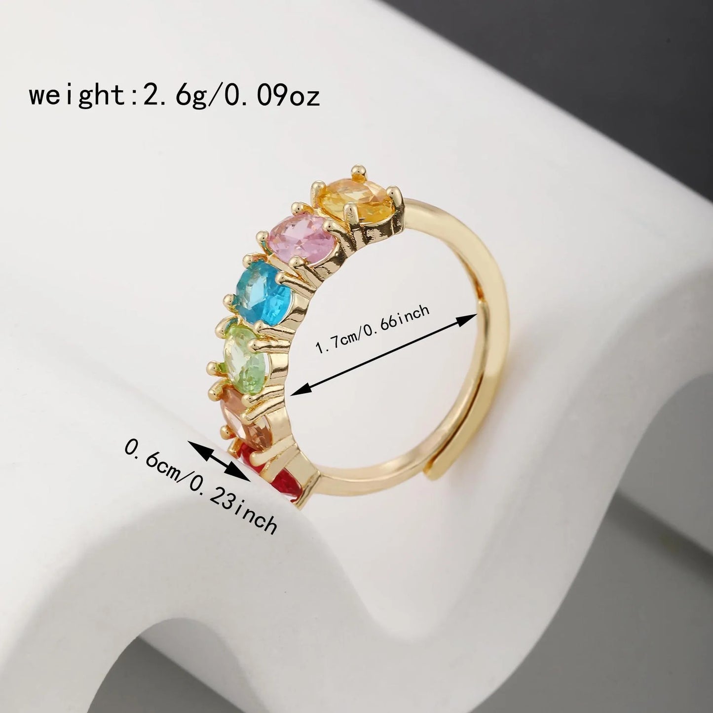 Gold electroplated adjustable open band zircon ring on white background