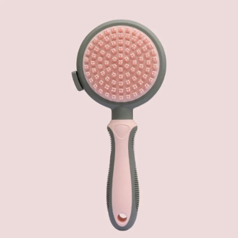 Green and pink two-sided pet brush showing retractable slicker bristles and silicone massage nubs on a white background.