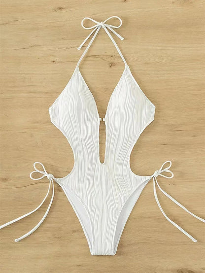 Women's black triangle bikini with white lace-up ties on the top