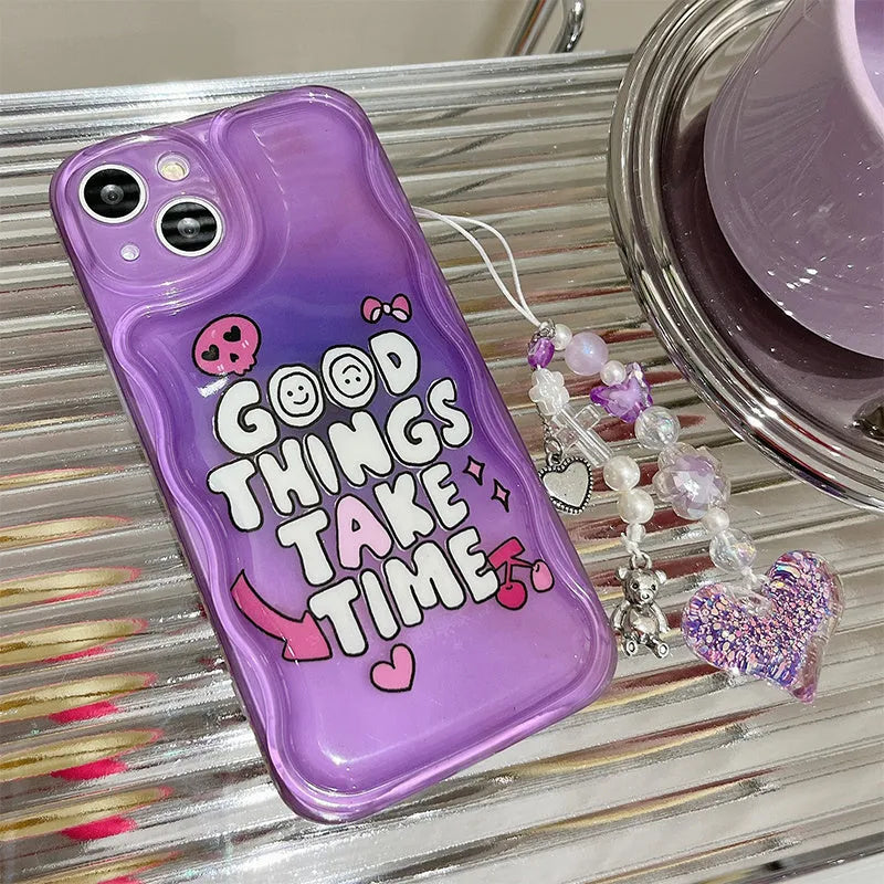 Purple graffiti design iPhone case with a silver love pendant chain attached