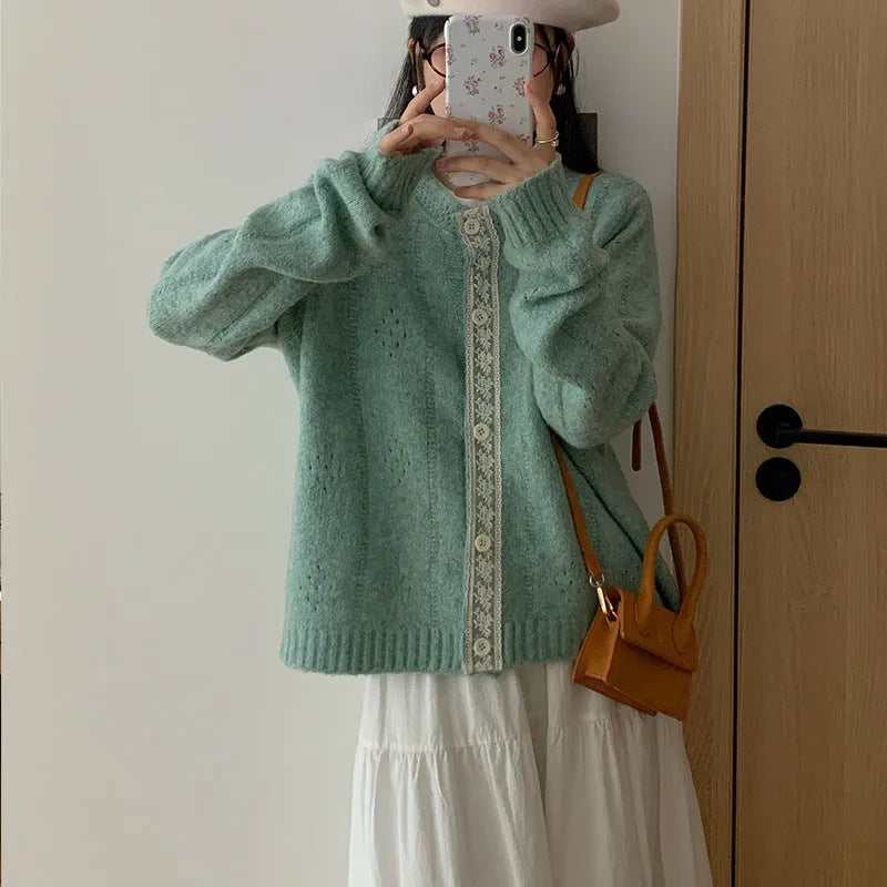 Loose-fitting artistic retro sweater coat in viscose fibre, shown in apricot colour.