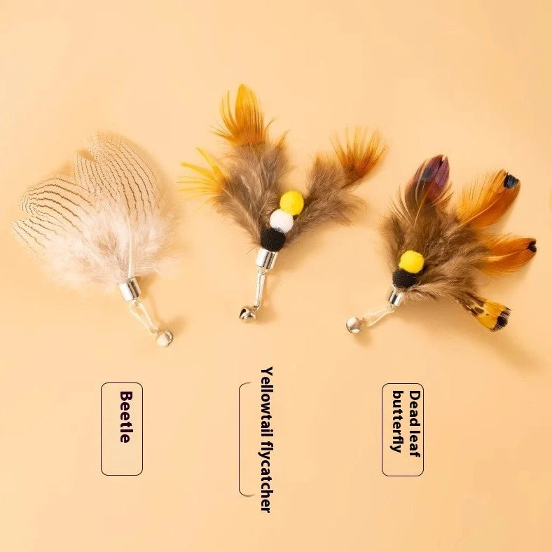 Three steel wire cat toy replacement heads with small flying insect designs in varied colours