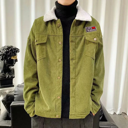 Men's loose fit corduroy work jacket in khaki on a hanger.
