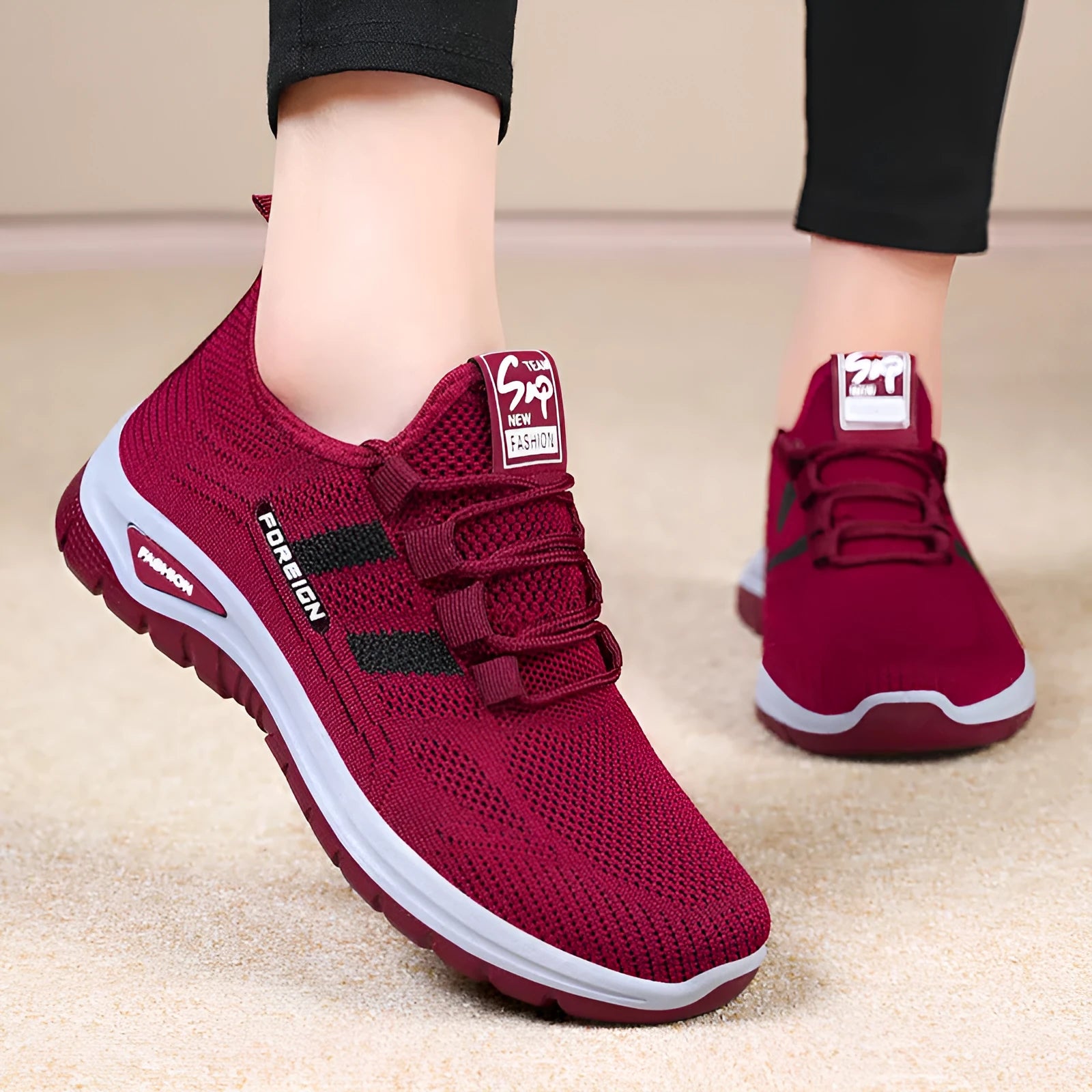 Low-top casual shoes with mesh upper and flat PVC sole in black, grey, purple, or red.