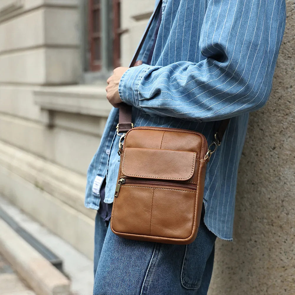 Men's brown leather crossbody shoulder bag with visible stitching and polyester cotton lining