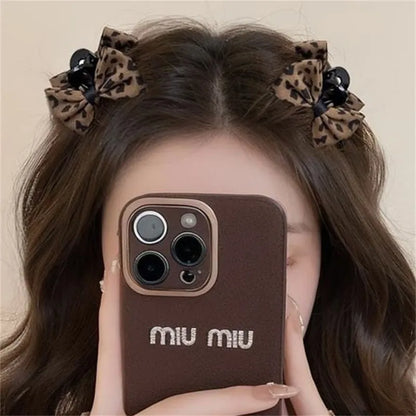 Pair of plastic hair barrettes with bow, leopard, bead and triangle styles for women's bangs