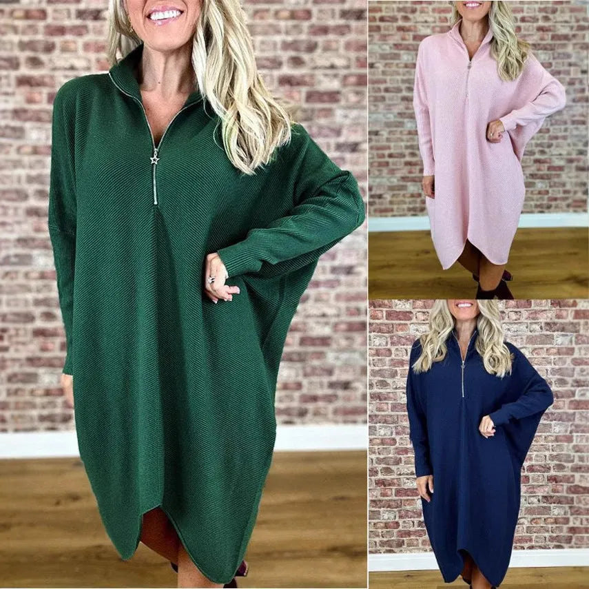 Women's solid colour loose fit knitted dress with raglan sleeves and a front zipper.