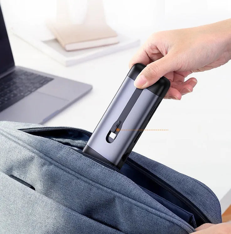 Dock expansion USB adapter converter with HDMI, PD charging, and USB 3.0 ports on a desk