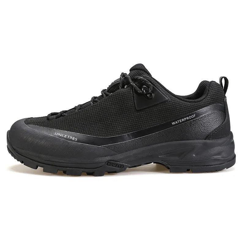 Men's low-top hiking boots in black with lace-up front and rubber outsole.
