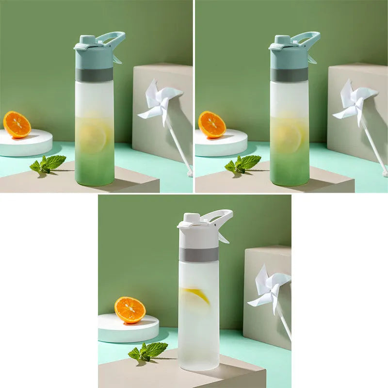 Large plastic spray water bottle with handle strap and leakproof lid in green colour.