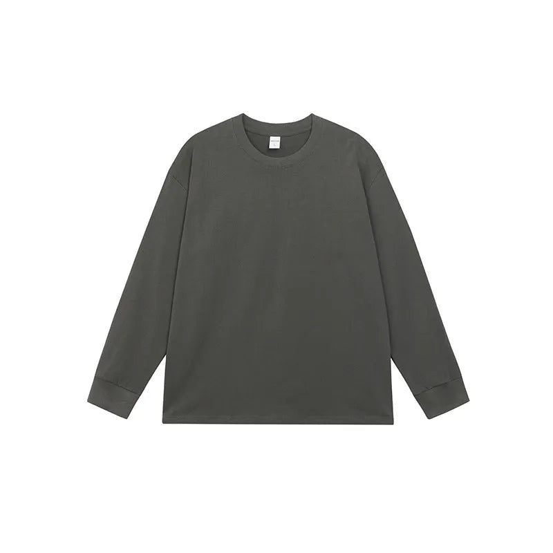 Man wearing a simple solid colour long sleeve cotton t-shirt in a loose, casual fit.