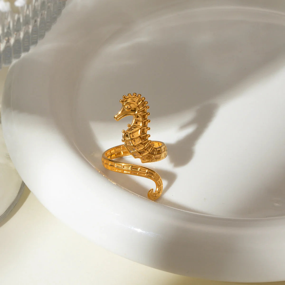 Shimmering 18K gold stainless steel cocktail ring with intricate seahorse design