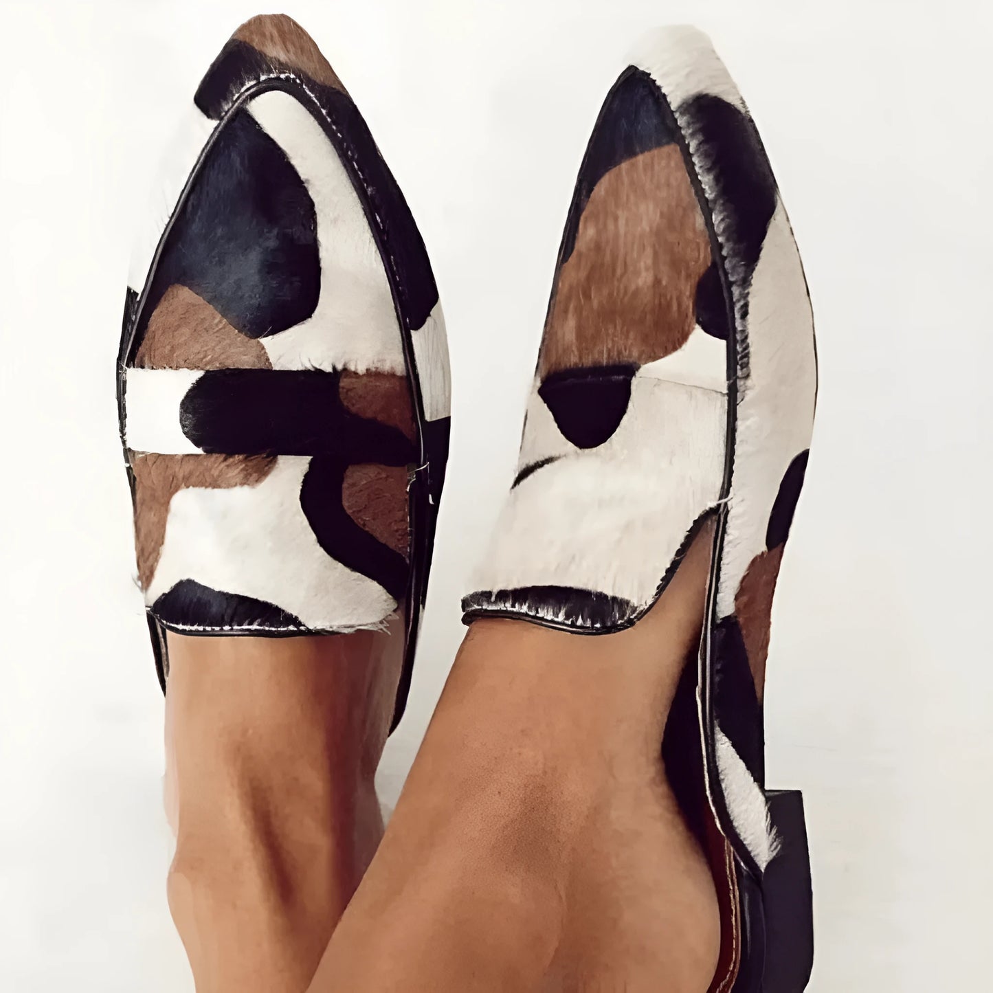 Women's black and white apricot retro pointed-toe shoes with imitation horsehair detail on suede upper and low rubber sole.