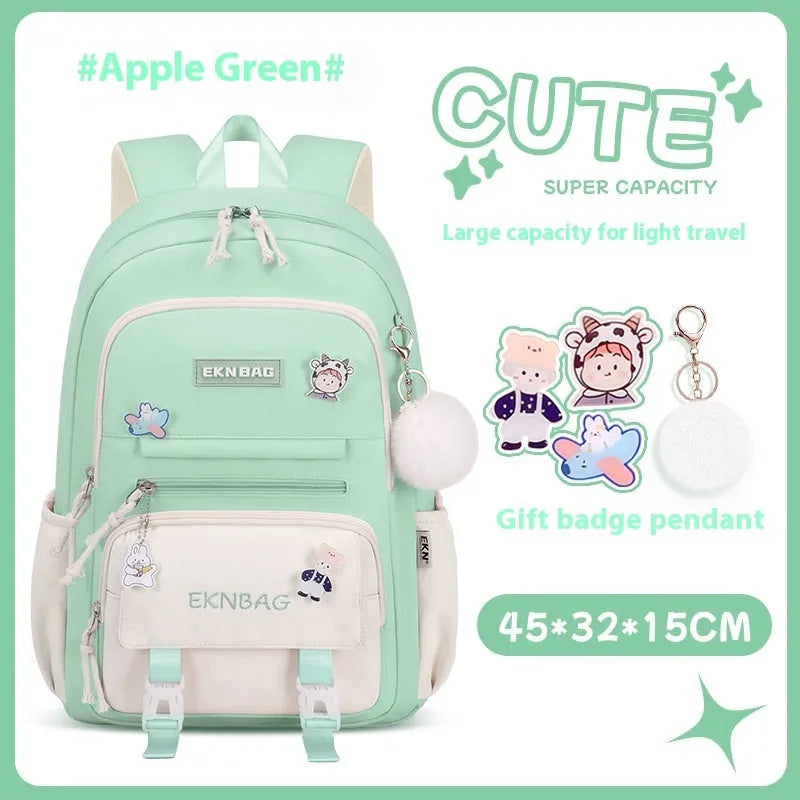 Pink waterproof Oxford cloth school backpack for girls with curved shoulder straps, shown with matching pencil case.
