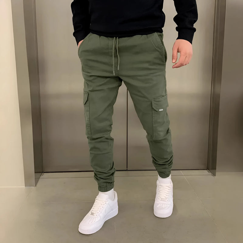 Men's dimensional patch pocket overalls with lace elastic waistband: loose-fit polyester trousers for casual wear, available in seven colours and eight sizes from S to 4XL, featuring a straight-leg cut suitable for all seasons.