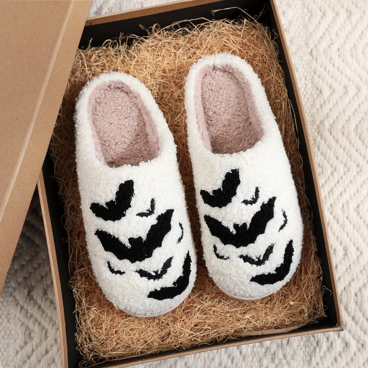 Halloween bat design plush slippers for indoor wear, available in white and black
