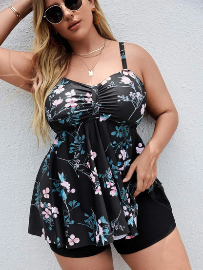 Women's one-piece swimsuit with a split colour floral print, shown on a mannequin.