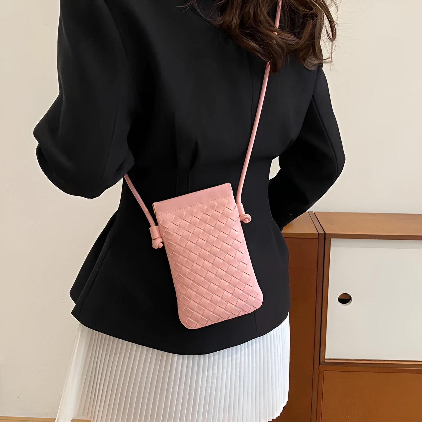 Vertical square vintage weave crossbody bag in multiple colours showing internal dark cell phone pocket.