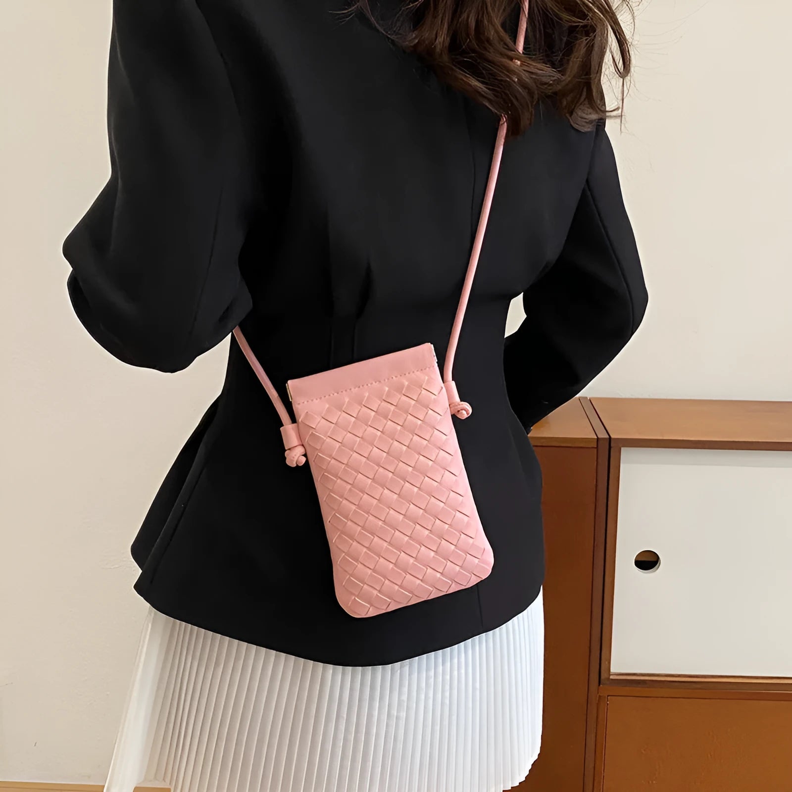 Vertical square vintage weave crossbody bag in multiple colours showing internal dark cell phone pocket.