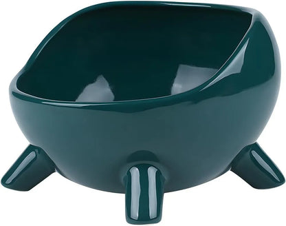 Green ceramic cat food bowl with four legs and elevated design for stable feeding