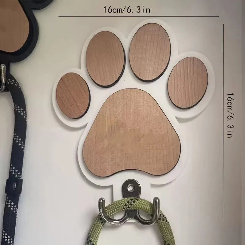Black and white wooden paw print shaped wall hook for hanging keys or coats