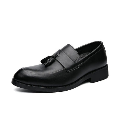 Men's black and brown business casual slip-on shoes with tassel detail and pointed toe