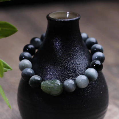 Black bracelet with 10mm Eagle Eye Stone beads and genuine Hetian jade Pixiu pendant