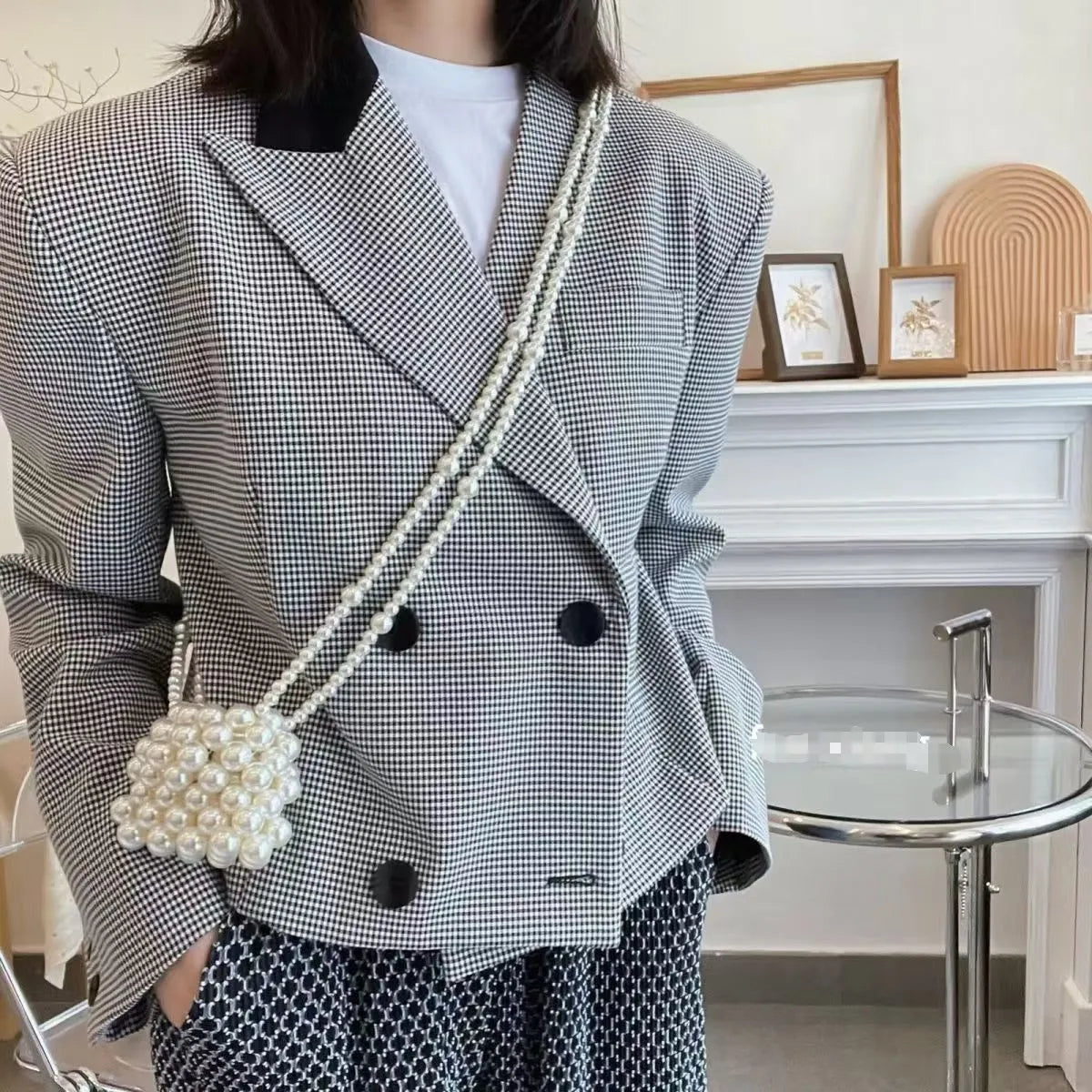 Women's imitation pearl mini crossbody handbag with geometric pattern in a pearl colour.