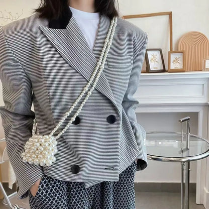 Women's imitation pearl mini crossbody handbag with geometric pattern in a pearl colour.