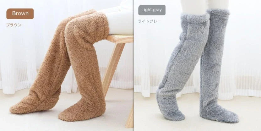 Cozy over-the-knee fuzzy socks in various colors, including brown, blue, dark gray, pink, silver, and more. Comfortable cotton design for warm, snug legs.